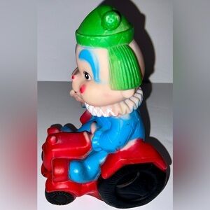 Vintage Squeaky toy - clown riding a red tractor - made in Taiwan